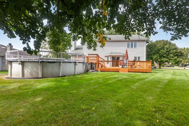 a view of a house with a backyard porch and sitting area