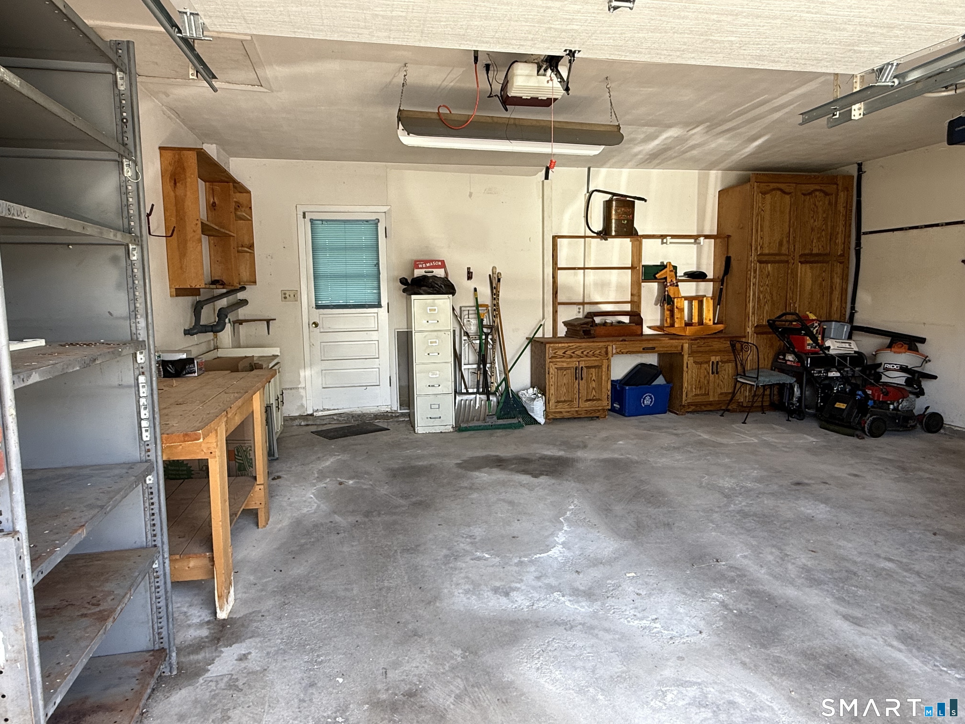 26 Maple Street Trumbull, CT 06611 - Photo 37 of 37 a view of a garage with a white car