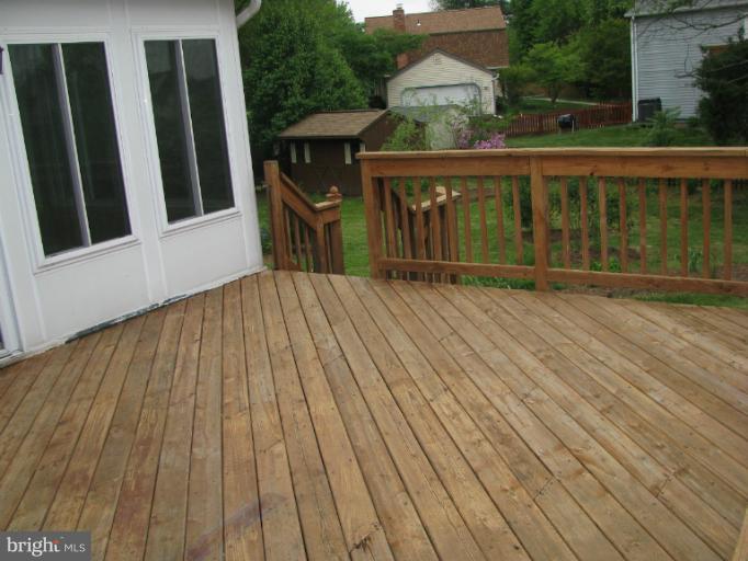 a view of deck with a flat tv screen and a wooden deck