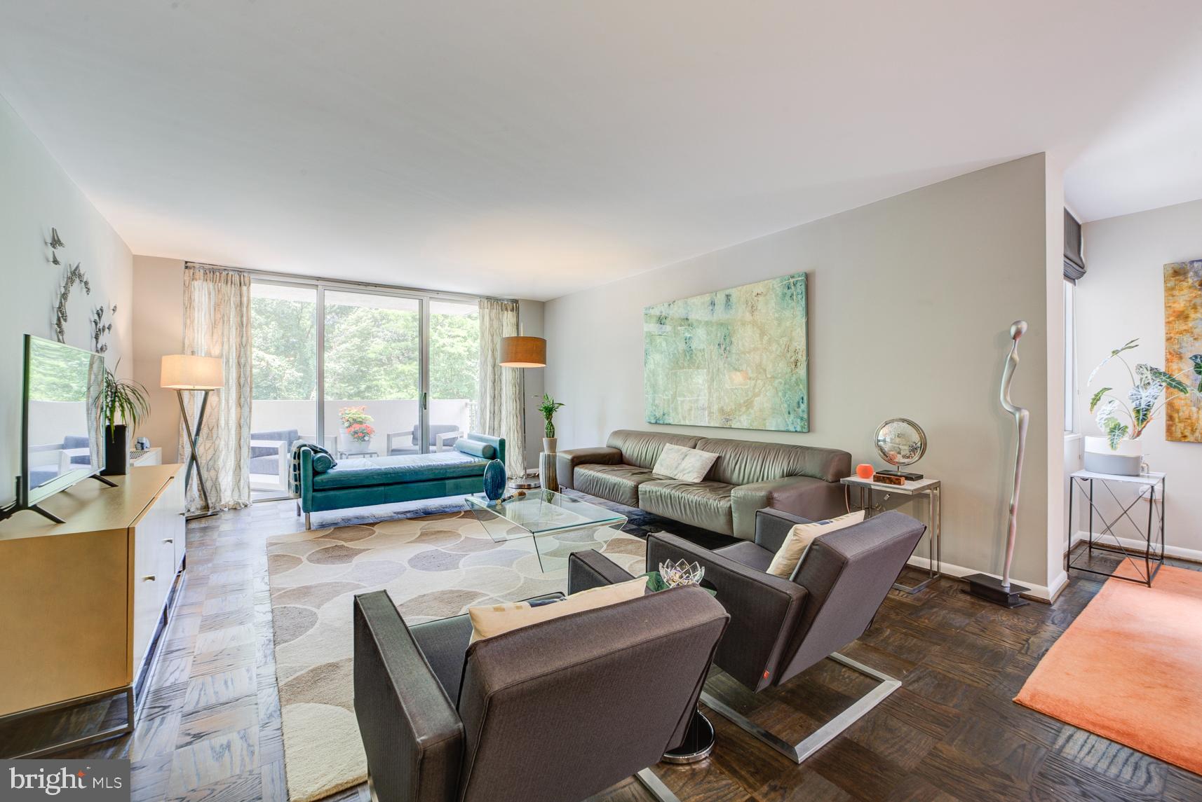 2939 Van Ness Street Northwest, Unit 224 Washington, DC 20008 - Photo 2 of 43 Large living room and plentiful natural light