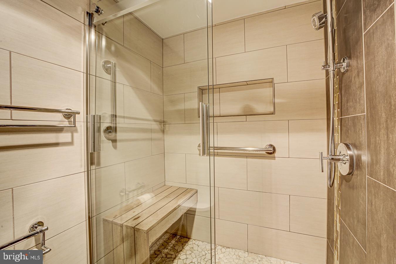 2939 Van Ness Street Northwest, Unit 224 Washington, DC 20008 - Photo 21 of 43 Sleek modern primary bath with elegant finishes