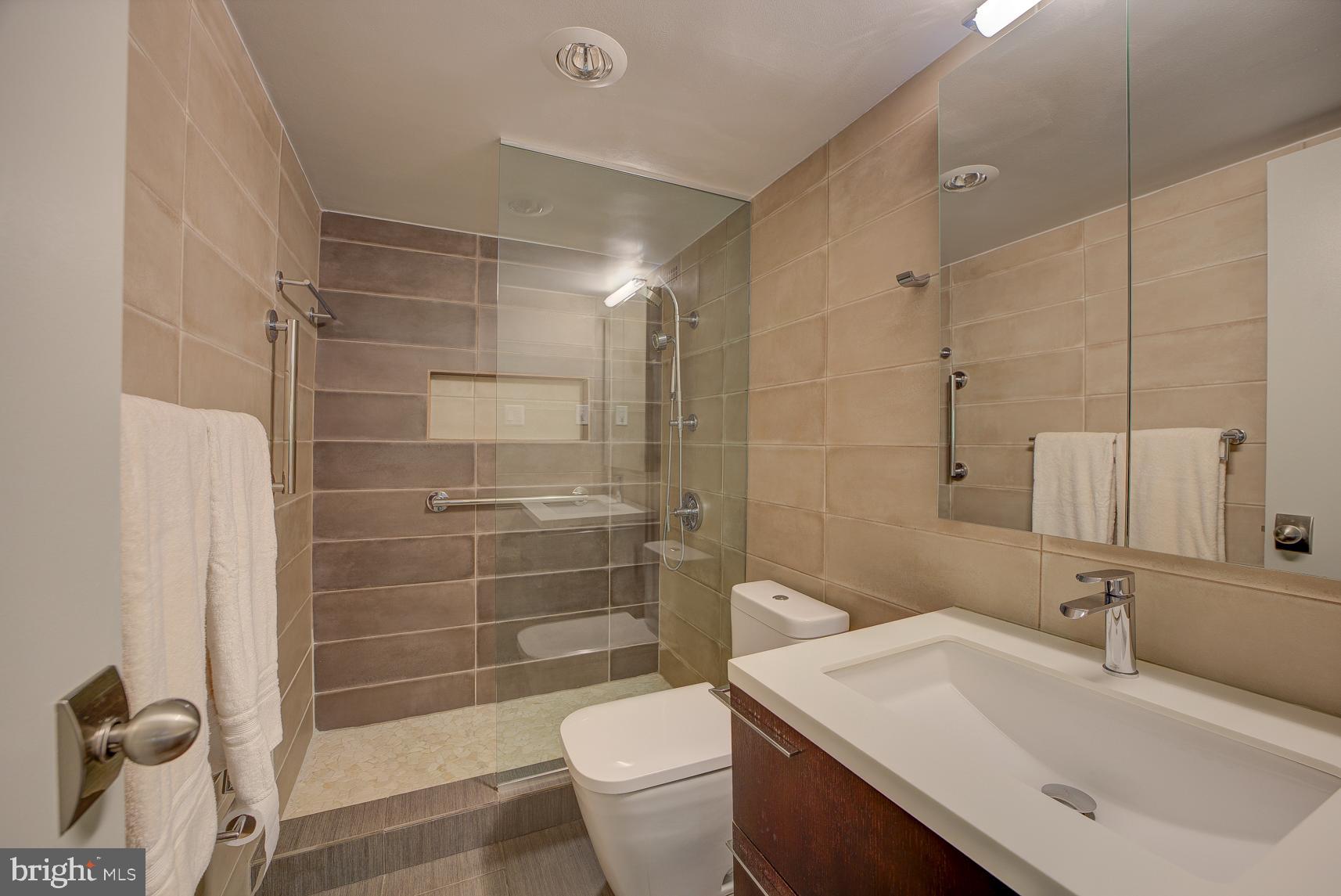 2939 Van Ness Street Northwest, Unit 224 Washington, DC 20008 - Photo 26 of 43 Designer spa-like bathrooms with modern tile