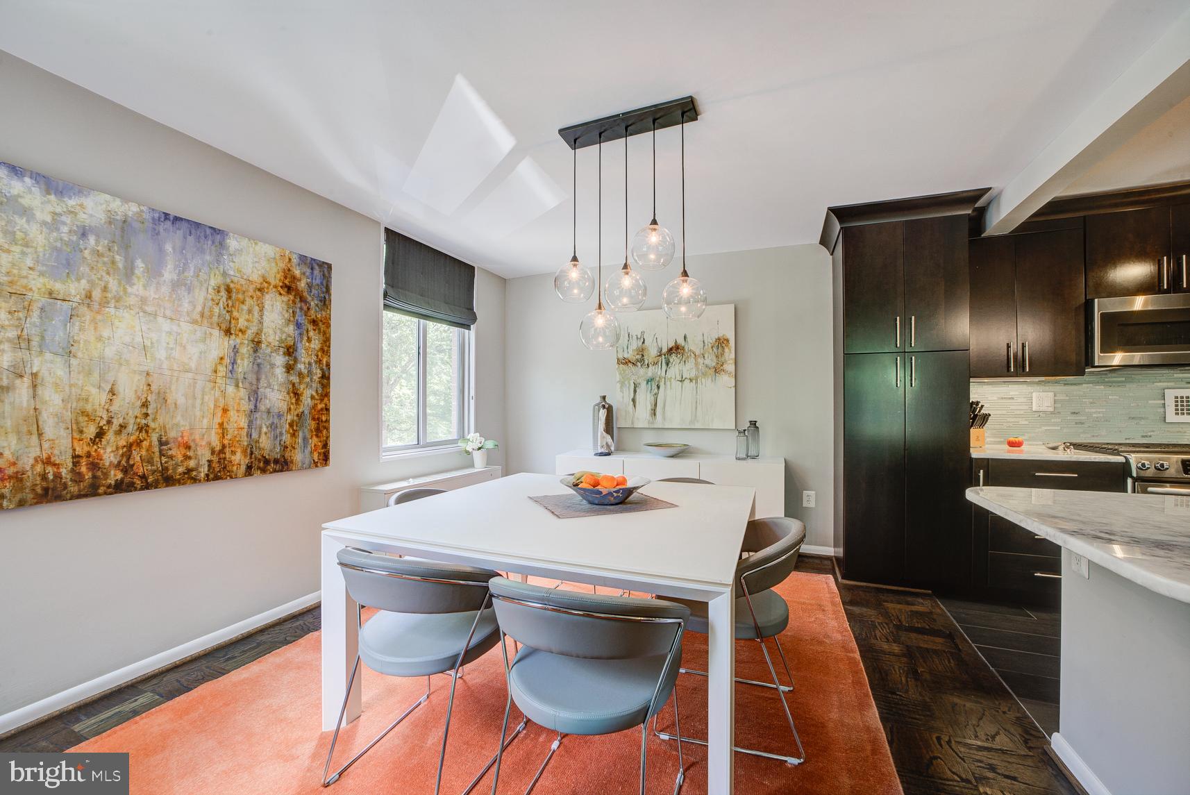 2939 Van Ness Street Northwest, Unit 224 Washington, DC 20008 - Photo 9 of 43 Custom Roman linen shades in the dining room