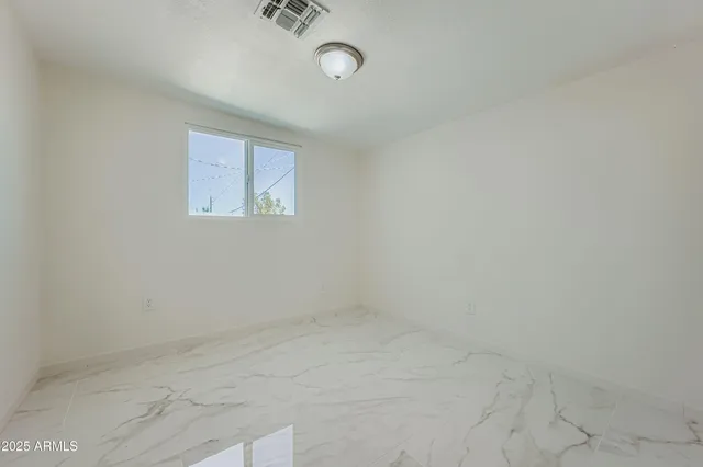 a bathroom with a sink mirror toilet and shower