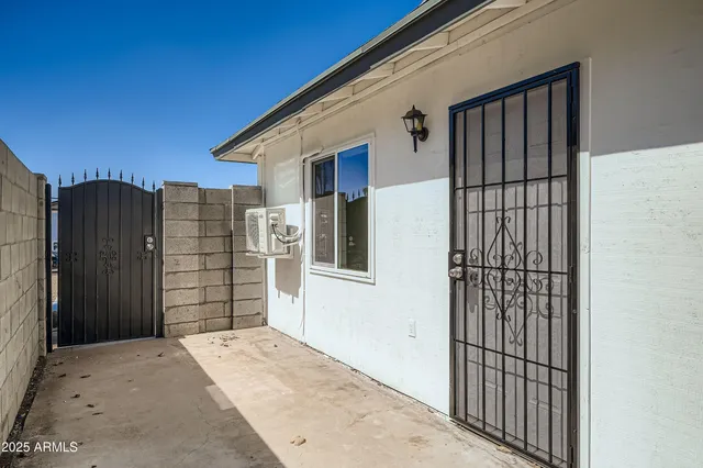 a view of a kitchen with a sink and a refrigerator