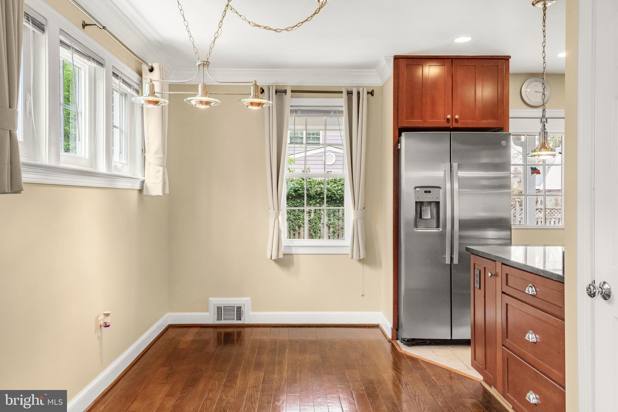 9505 Riley Road Silver Spring, MD 20910 - Photo 16 of 41 a view of empty room with wooden floor and fan