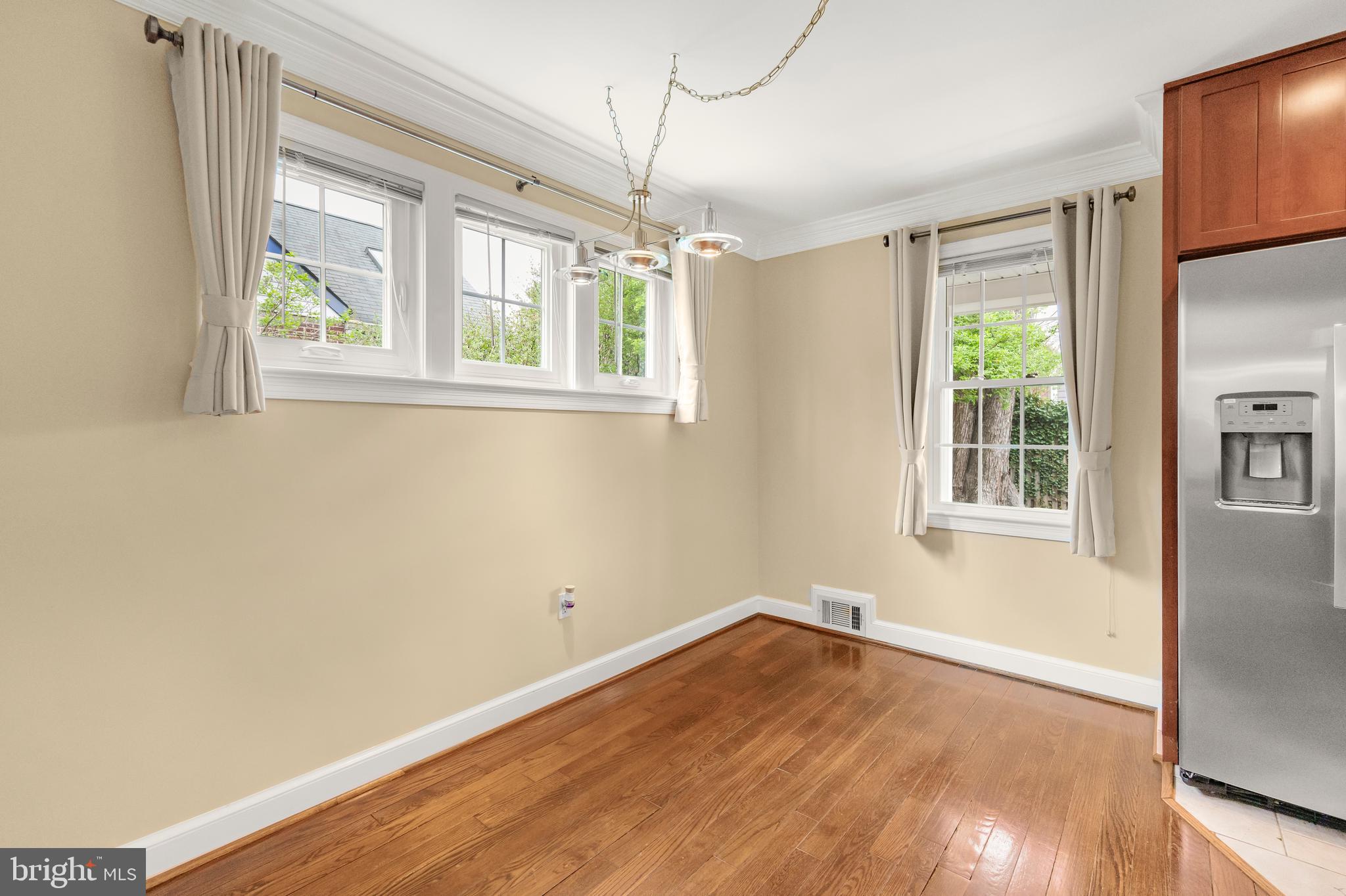 9505 Riley Road Silver Spring, MD 20910 - Photo 17 of 41 a view of empty room with wooden floor and fan