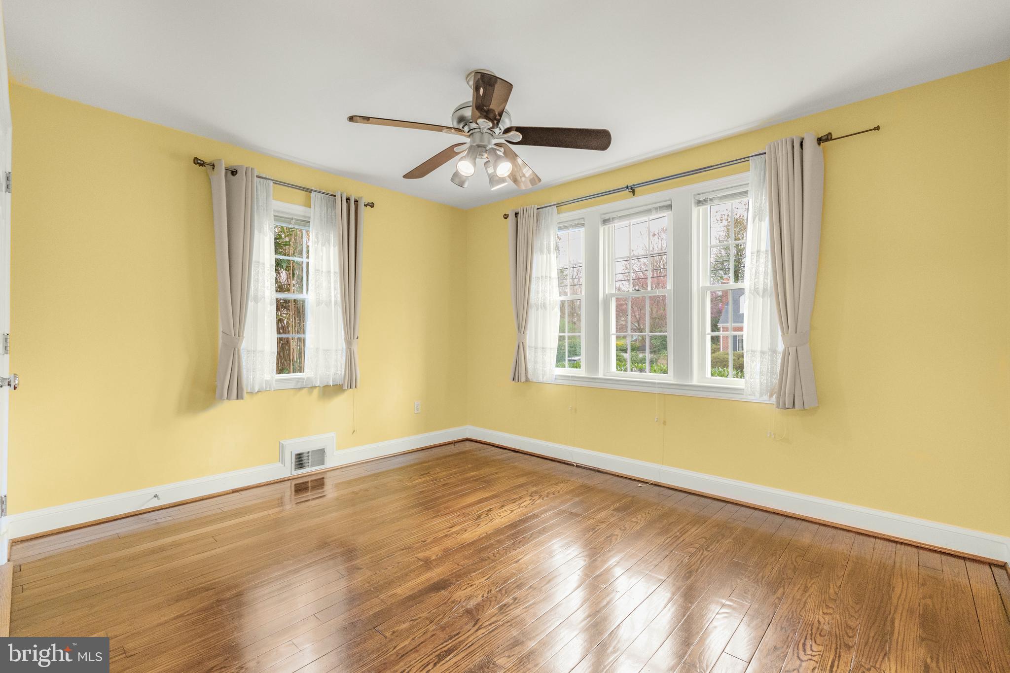 9505 Riley Road Silver Spring, MD 20910 - Photo 18 of 41 a view of an empty room with a window and wooden floor