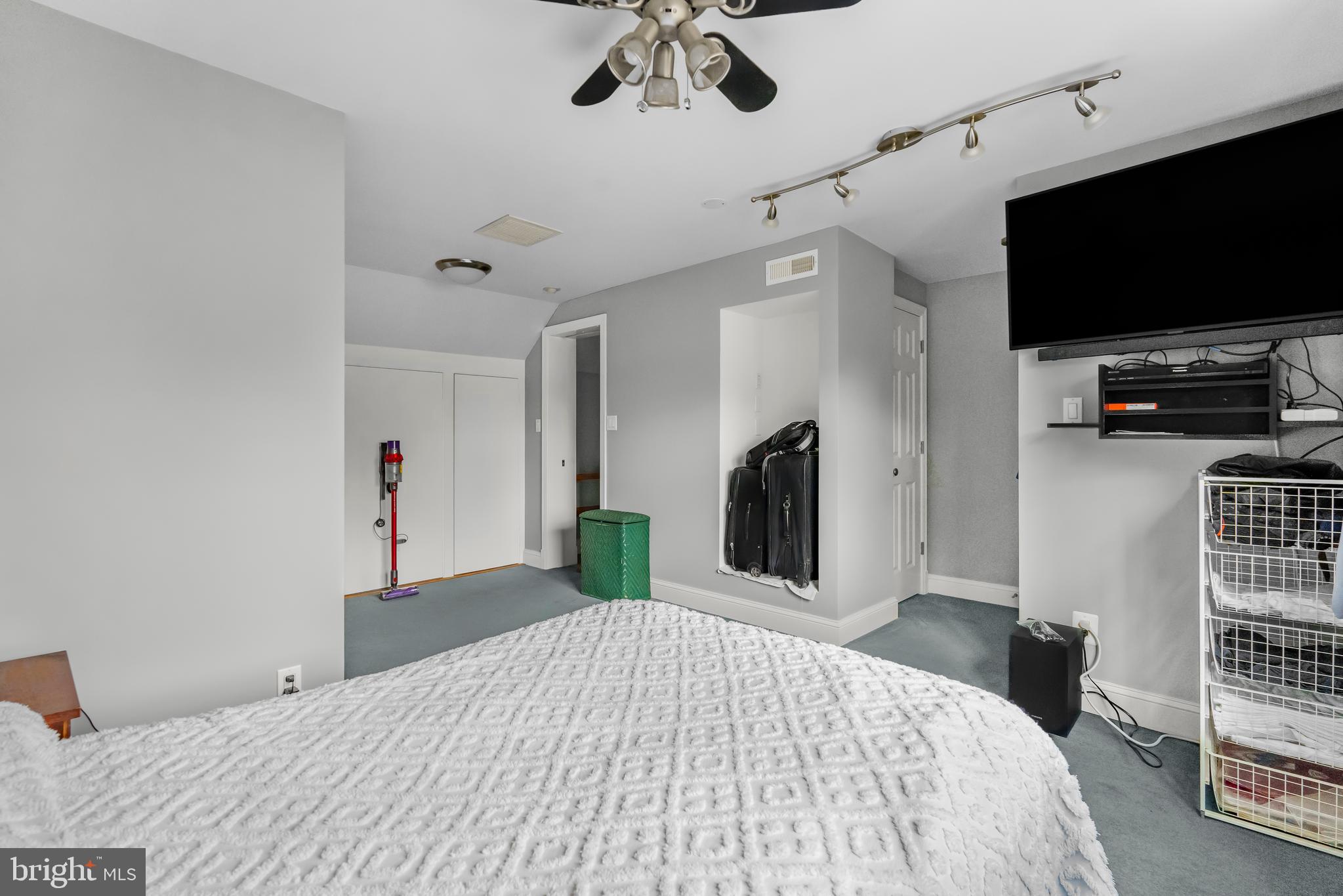 9505 Riley Road Silver Spring, MD 20910 - Photo 26 of 41 a bedroom with a bed and a flat screen tv