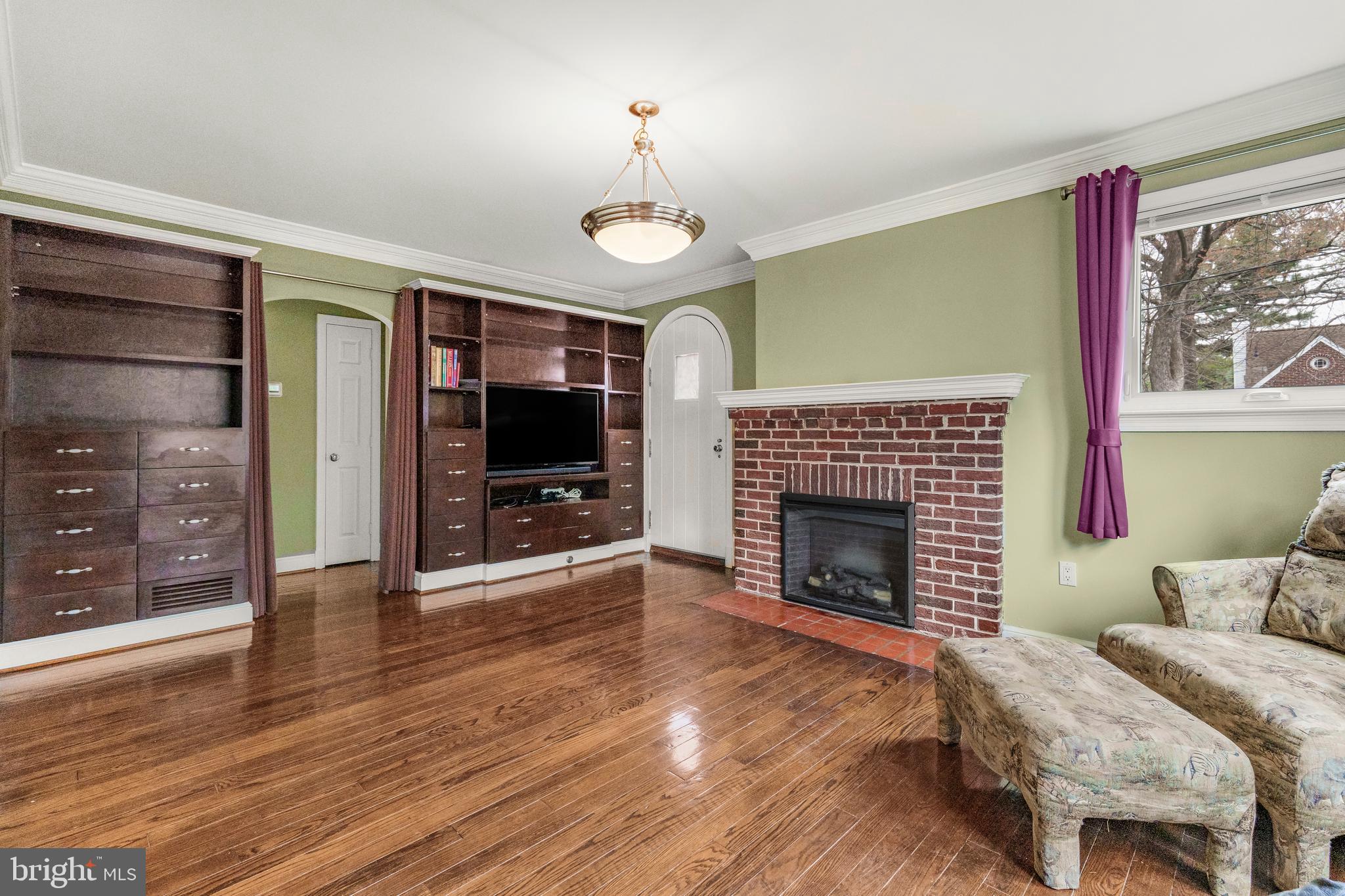 9505 Riley Road Silver Spring, MD 20910 - Photo 7 of 41 a living room with furniture and a fireplace