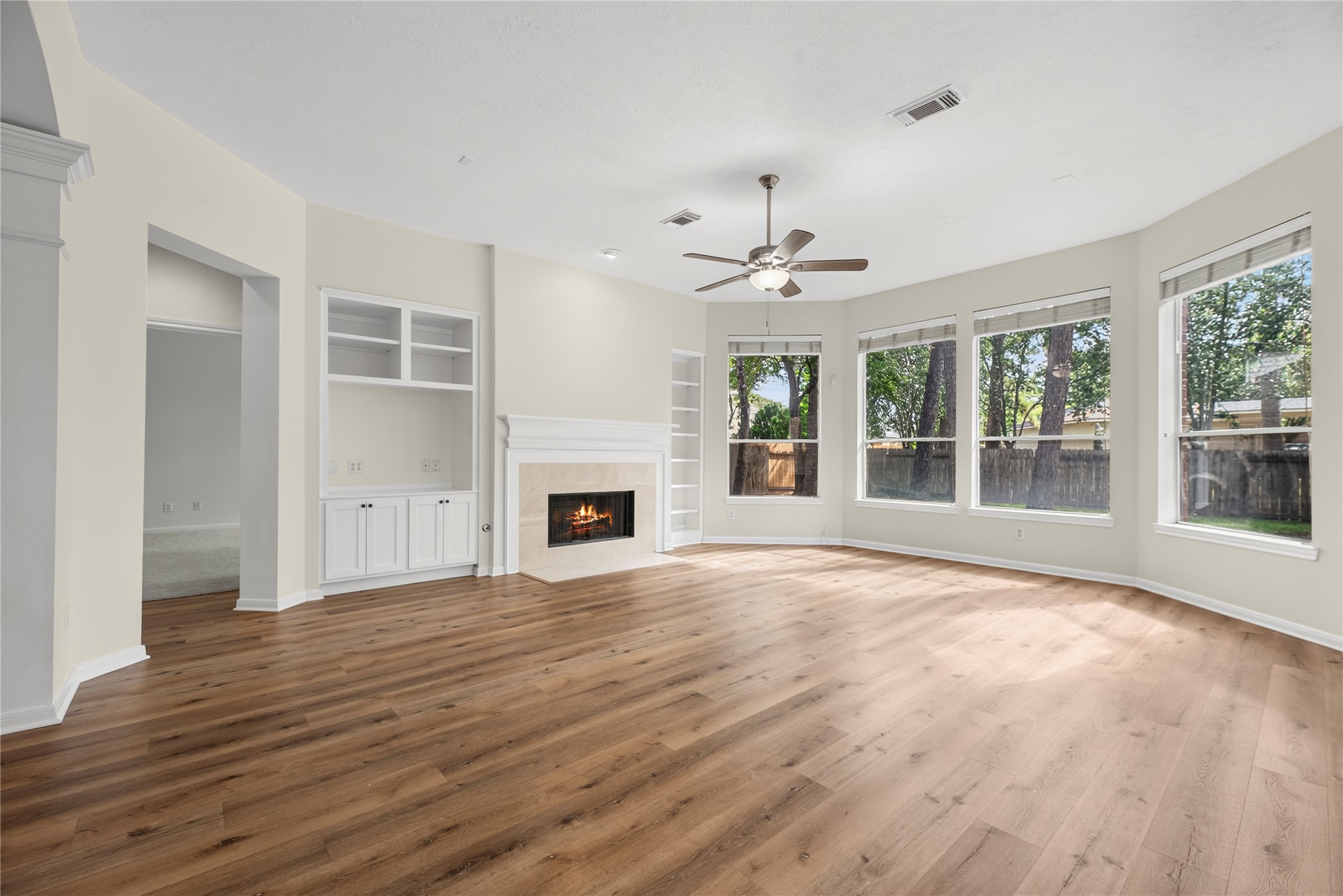 25830 Clear Springs Way Spring, TX 77373 - Photo 12 of 25 The family room offers custom built-ins, a cozy fireplace and great backyard views.