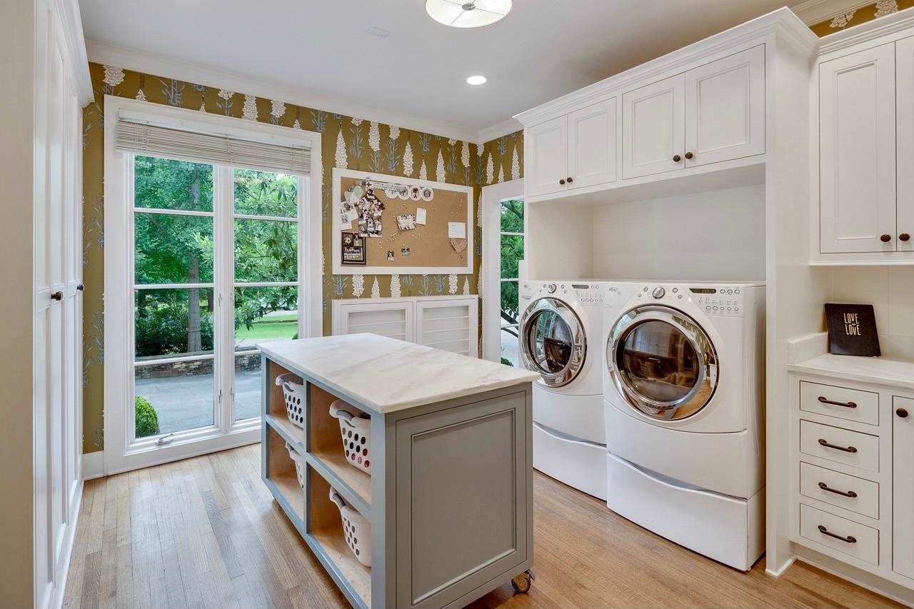 4315 Tuckahoe Road Memphis, TN 38117 - Photo 12 of 25 a utility room with cabinets washer and dryer