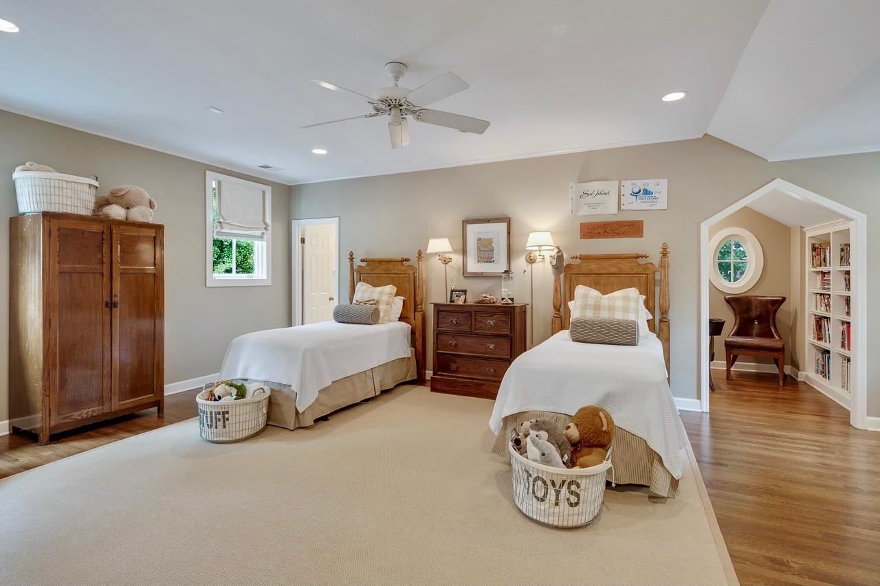 4315 Tuckahoe Road Memphis, TN 38117 - Photo 21 of 25 a bedroom with furniture and a chandelier