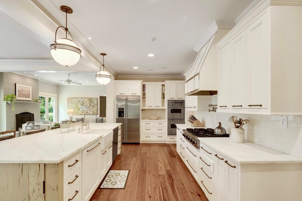 4315 Tuckahoe Road Memphis, TN 38117 - Photo 5 of 25 a large white kitchen with a large window a sink and stainless steel appliances