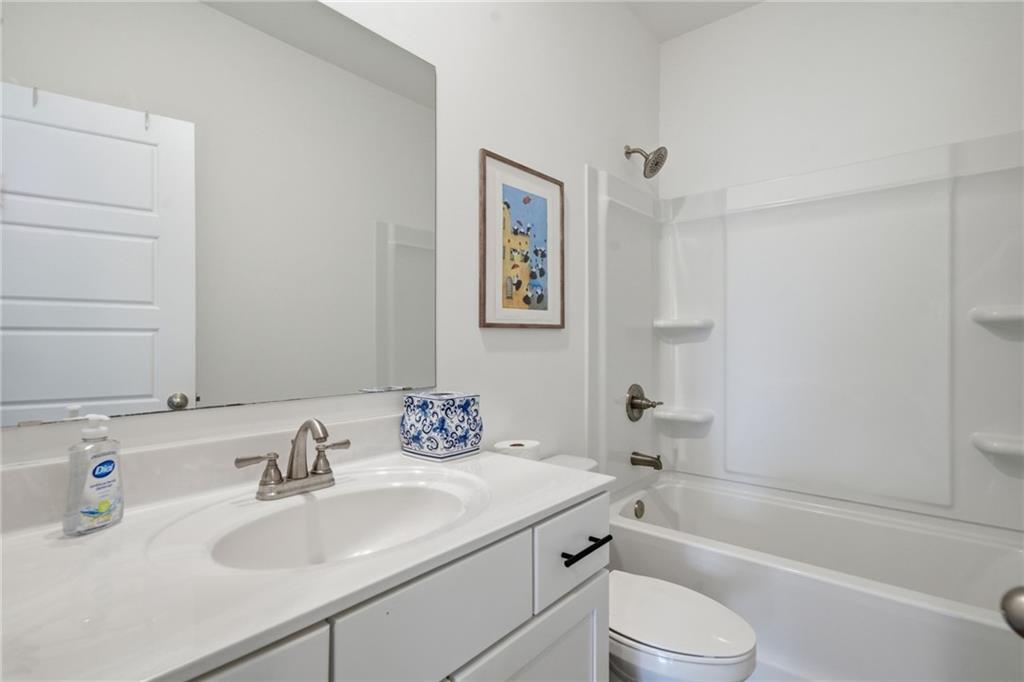 3158 Webb Road Milton, GA 30004 - Photo 15 of 36 a bathroom with a sink toilet and a bathtub