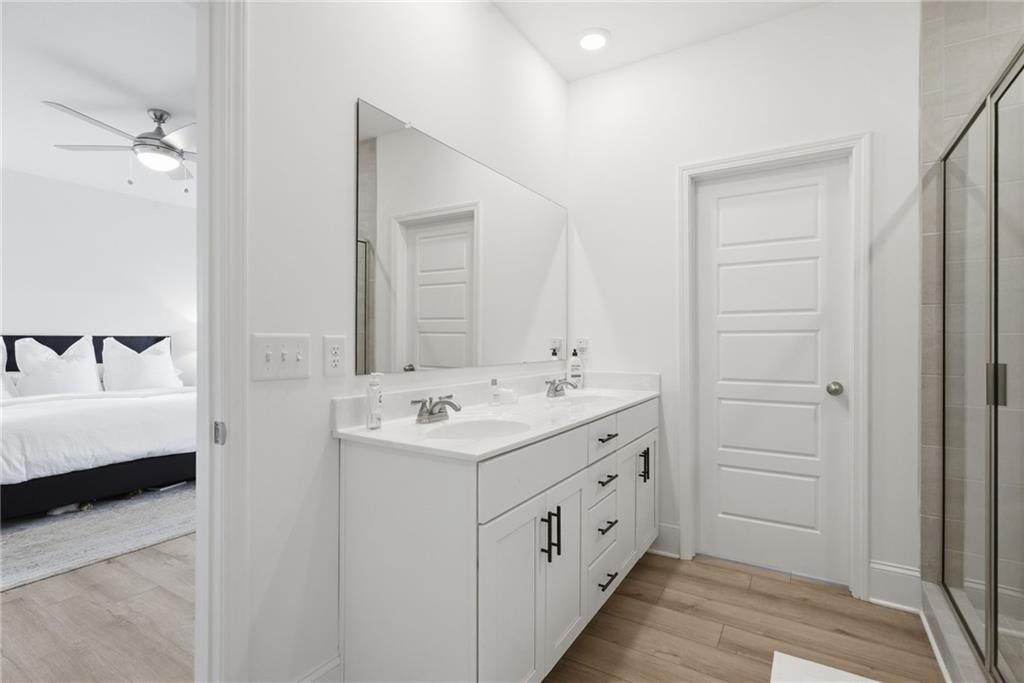 3158 Webb Road Milton, GA 30004 - Photo 20 of 36 a bathroom with a double vanity sink a and mirror