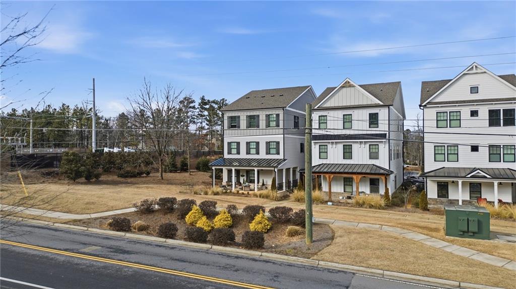 3158 Webb Road Milton, GA 30004 - Photo 27 of 36 a front view of residential houses with yard