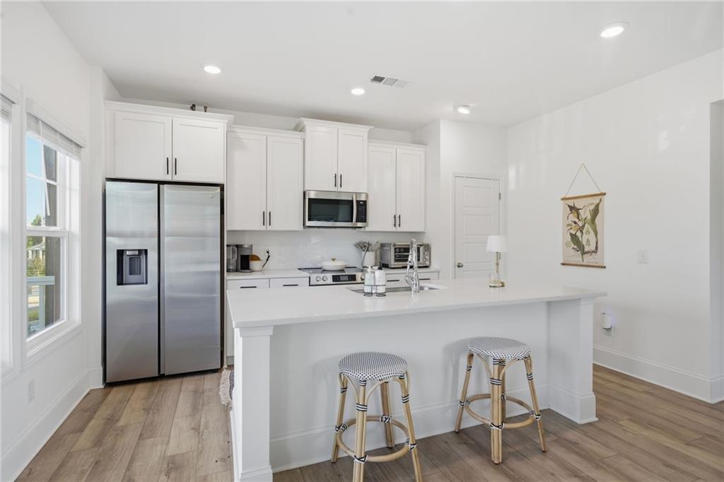 3158 Webb Road Milton, GA 30004 - Photo 10 of 36 a kitchen with stainless steel appliances a refrigerator sink and microwave