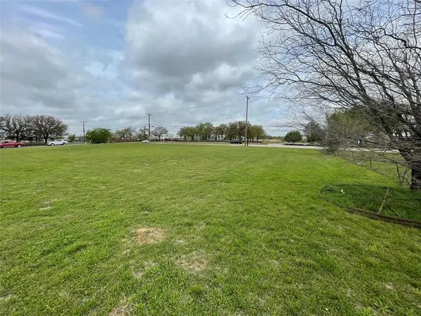 a fire hydrant in the middle of a field
