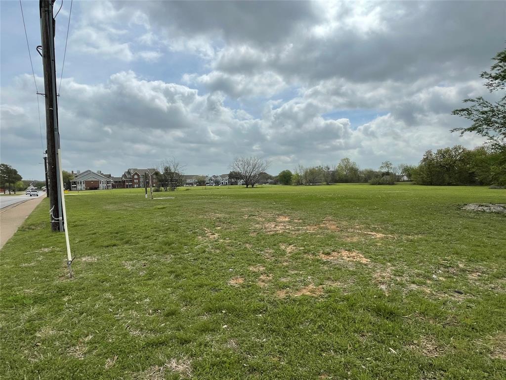 3708 Harwood Road Bedford, TX 76021 - Photo 15 of 18 a view of a field with a big yard