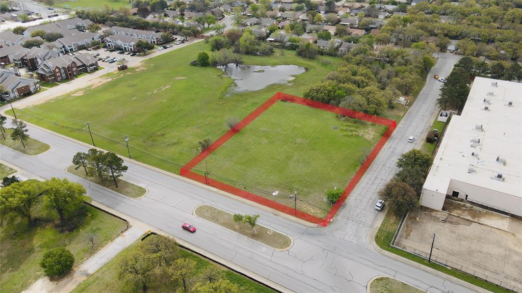 3708 Harwood Road Bedford, TX 76021 - Photo 2 of 18 an aerial view of a pool patio yard and lake view