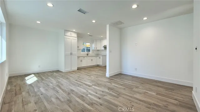 a view of kitchen and wooden floor