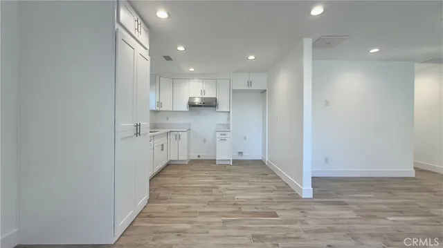 a view of kitchen with wooden floor