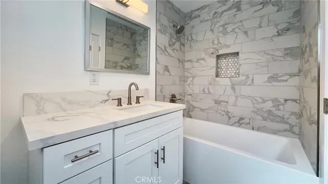 a bathroom with a sink and a bathtub
