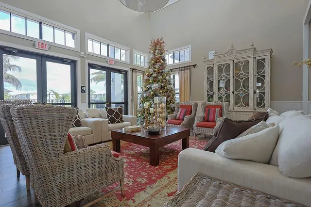 a living room with furniture a rug and a view