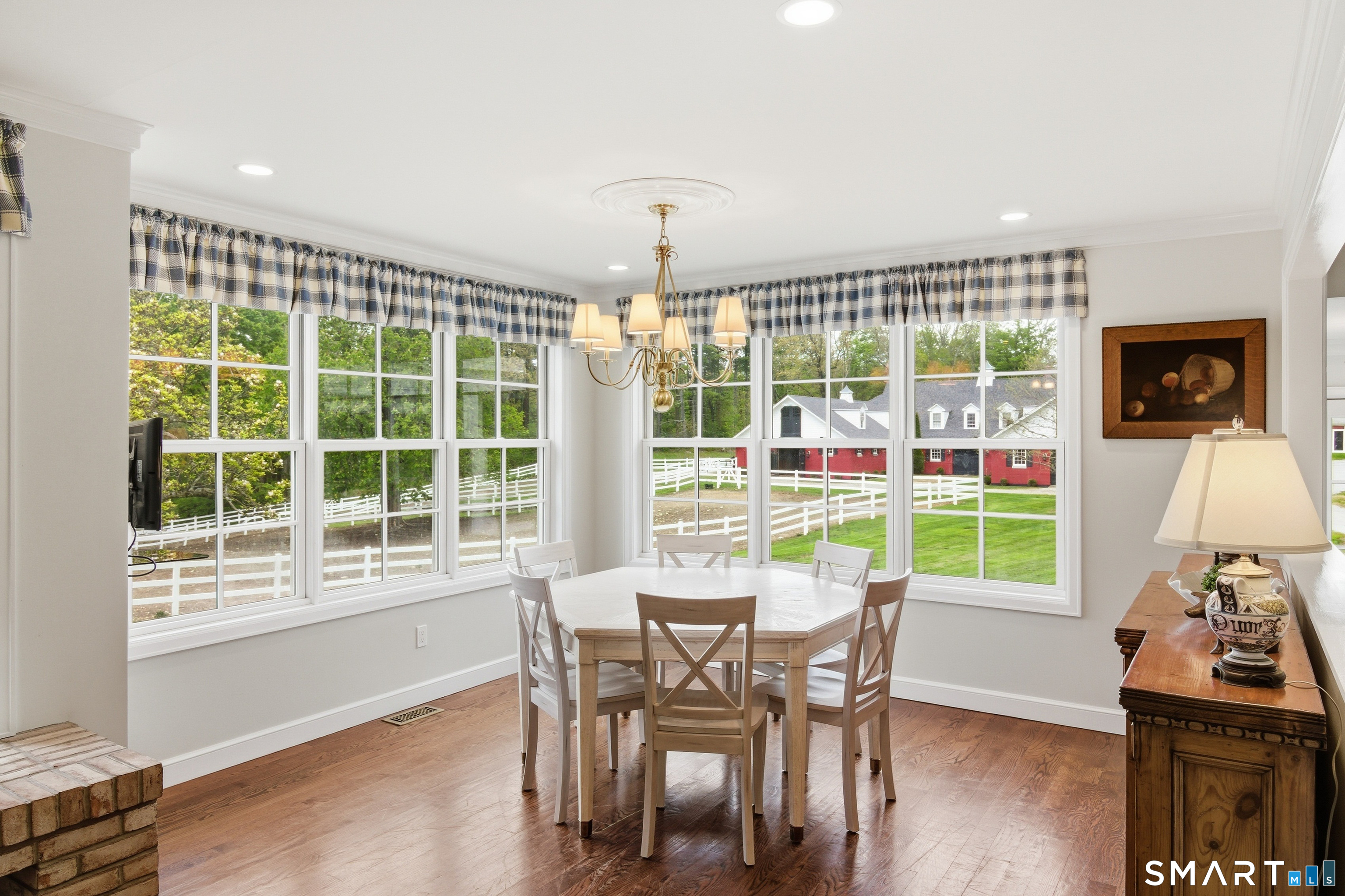 433 Wrights Crossing Road Pomfret, CT 06259 - Photo 19 of 36 Expansive windows offer remarkable views of the stables and property,