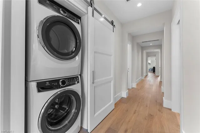 a view of a hallway with washer and dryer