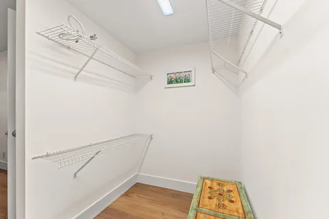 a view of small space with empty racks on the wall