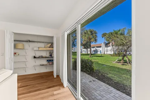 a view of a porch and wooden floor