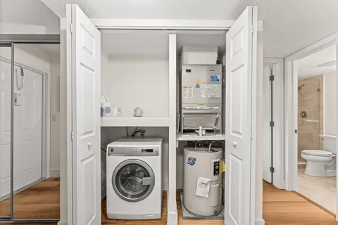 a view of a bathroom with washer and dryer