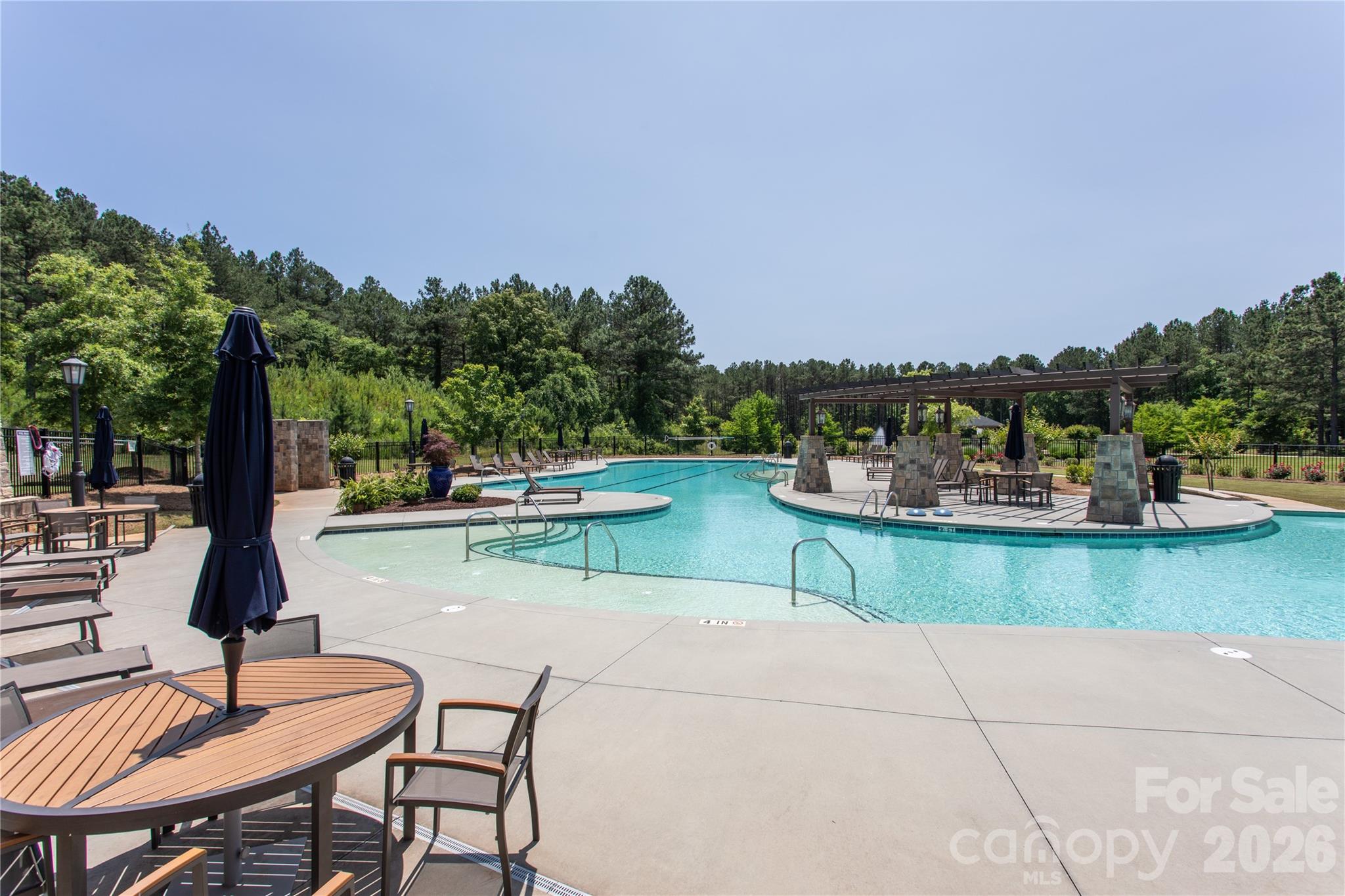8031 Gulf Crk Road Lancaster, SC 29720 - Photo 24 of 38 a view of a lake with a table and chairs