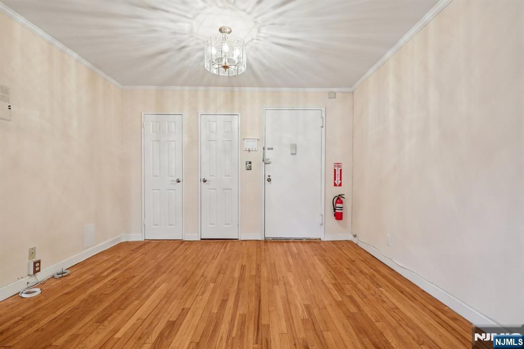 2160 Center, Unit 5N Fort Lee, NJ 07024 - Photo 14 of 30 a view of a room with wooden floor and a window