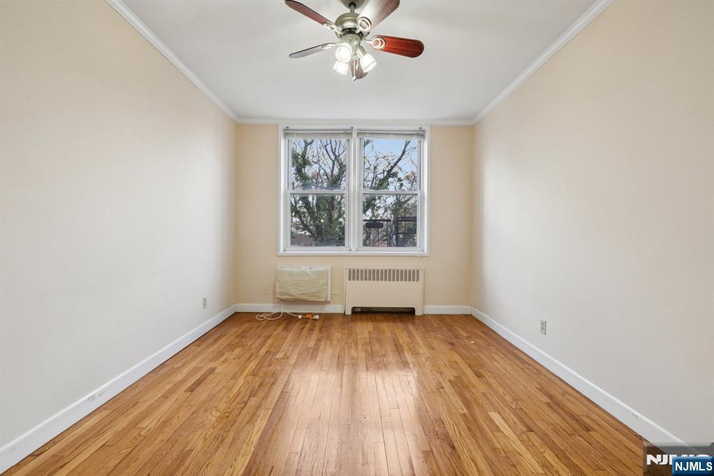 2160 Center, Unit 5N Fort Lee, NJ 07024 - Photo 19 of 30 wooden floor in an empty room with a window