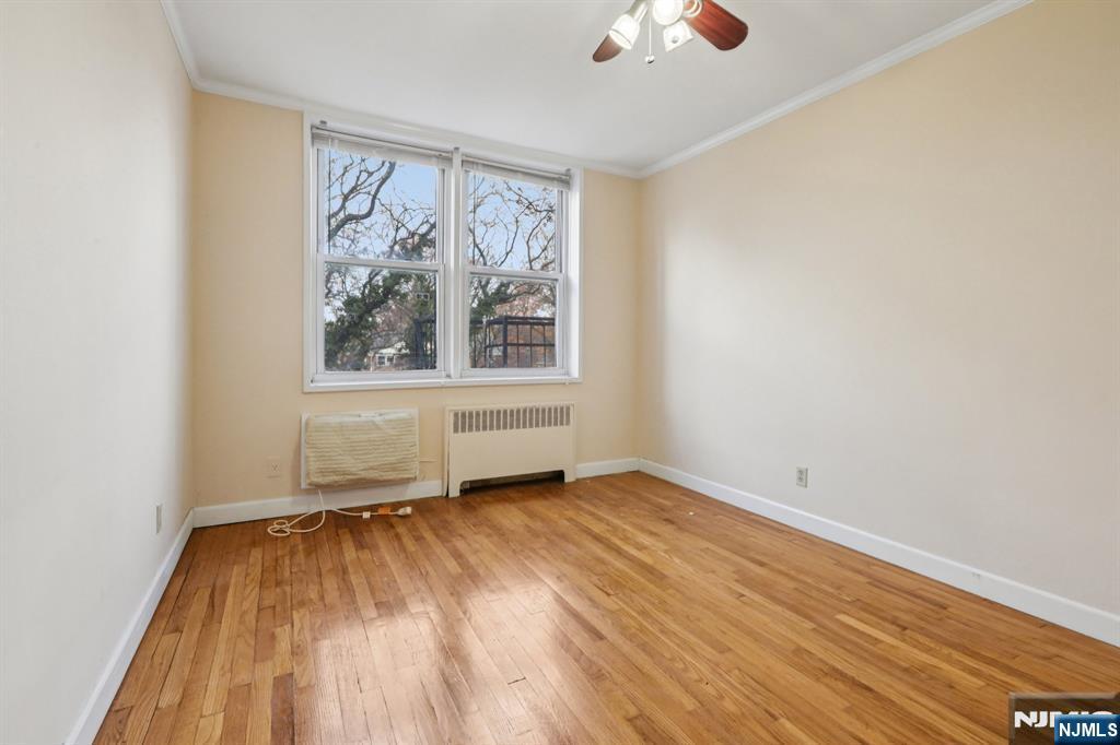 2160 Center, Unit 5N Fort Lee, NJ 07024 - Photo 20 of 30 wooden floor in an empty room with a window