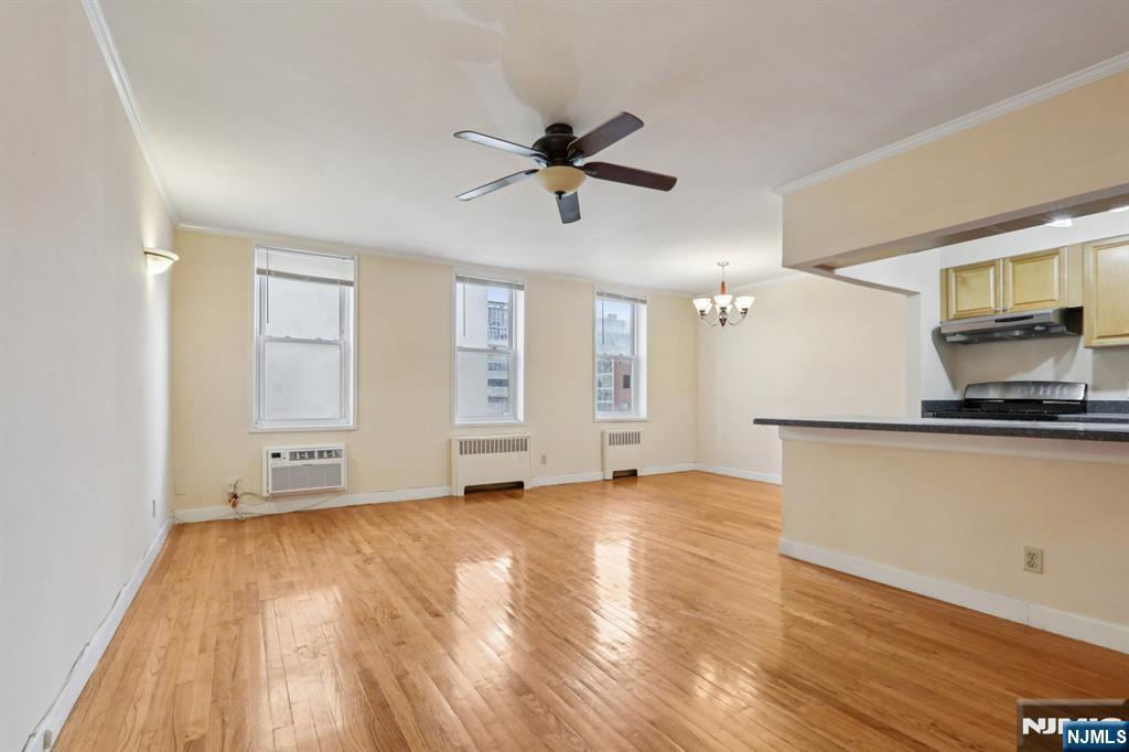 2160 Center, Unit 5N Fort Lee, NJ 07024 - Photo 7 of 30 a view of a livingroom with a ceiling fan and window