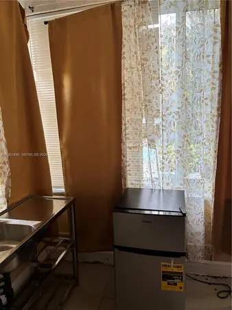 a bathroom with a sink toilet and a mirror