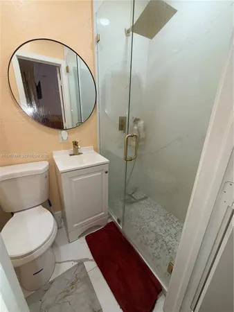 a bathroom with a toilet and a sink