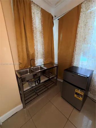 a room with wooden floor and furniture