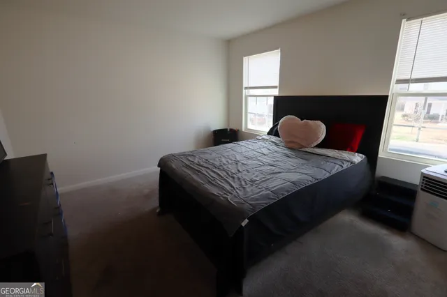 a bathroom with a sink mirror and toilet