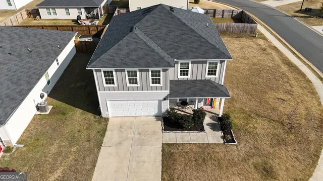 an aerial view of a house with roof