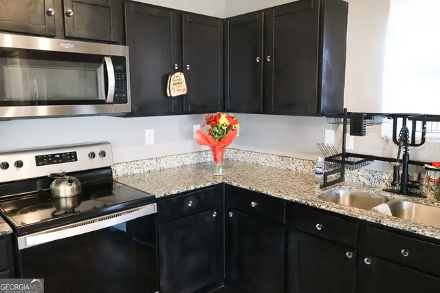 a kitchen with a sink and a microwave