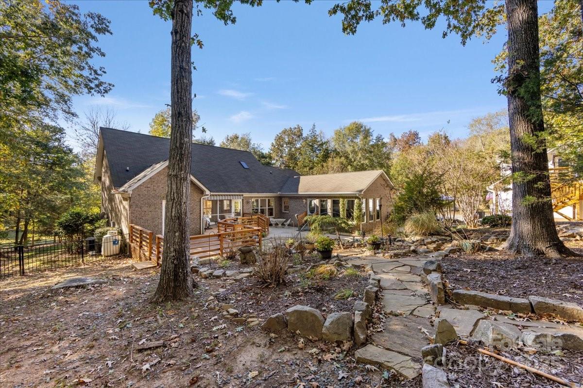 9701 Deer Run Road Waxhaw, NC 28173 - Photo 13 of 47 a view of a house with a yard