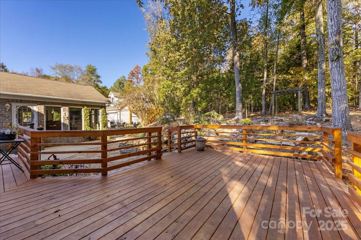 9701 Deer Run Road Waxhaw, NC 28173 - Photo 15 of 47 a view of a roof deck with wooden floor and fence