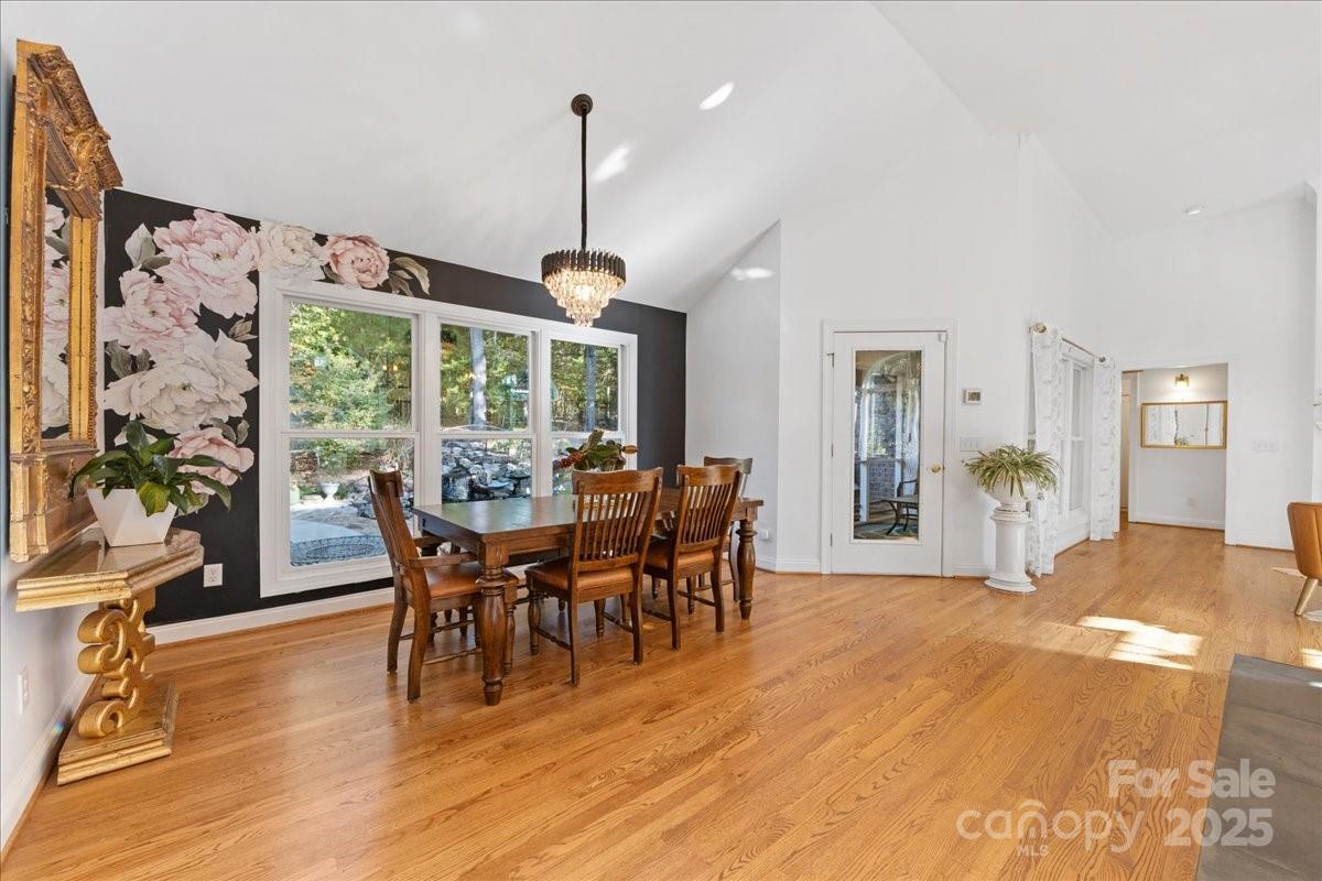 9701 Deer Run Road Waxhaw, NC 28173 - Photo 24 of 47 a view of a dining room with furniture window and wooden floor