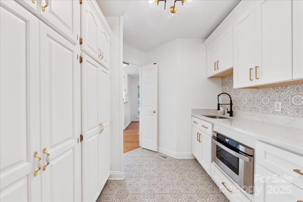 9701 Deer Run Road Waxhaw, NC 28173 - Photo 30 of 47 a view of a kitchen with a sink