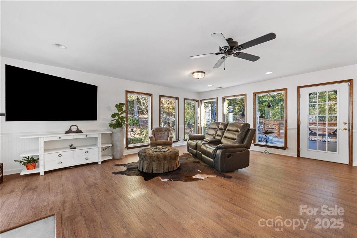 9701 Deer Run Road Waxhaw, NC 28173 - Photo 34 of 47 a living room with furniture and a flat screen tv
